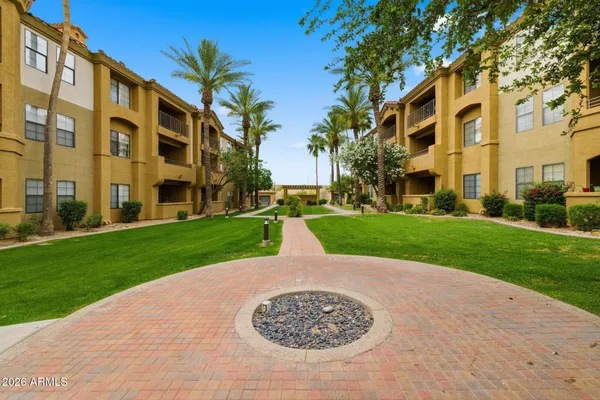 a view of a building with a yard