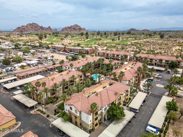 an aerial view of residential houses with outdoor space