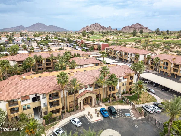 a view of multiple houses with yard