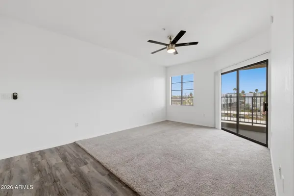a view of an empty room with a window