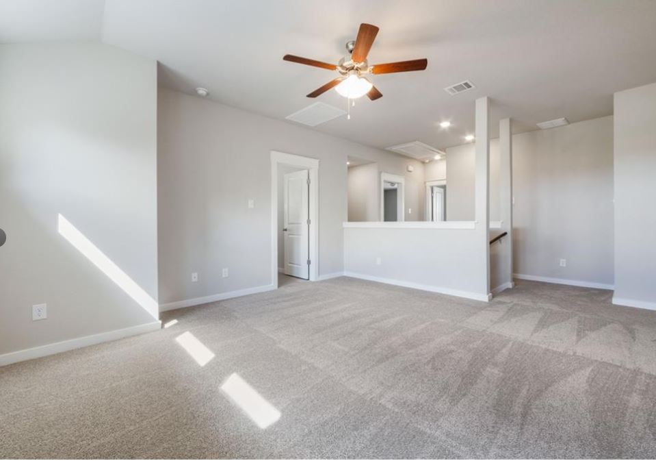 2221 Rocoso Trail Leander, TX 78641 - Photo 11 of 16 Unfurnished room featuring light colored carpet and ceiling fan