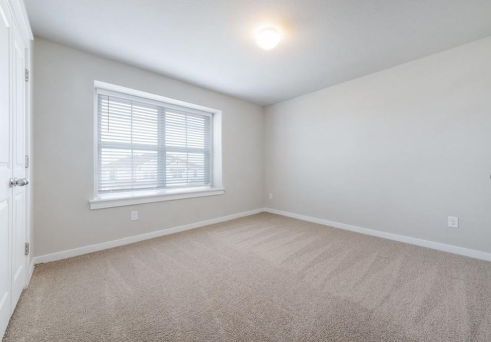 2221 Rocoso Trail Leander, TX 78641 - Photo 12 of 16 Spare room with light colored carpet and baseboards