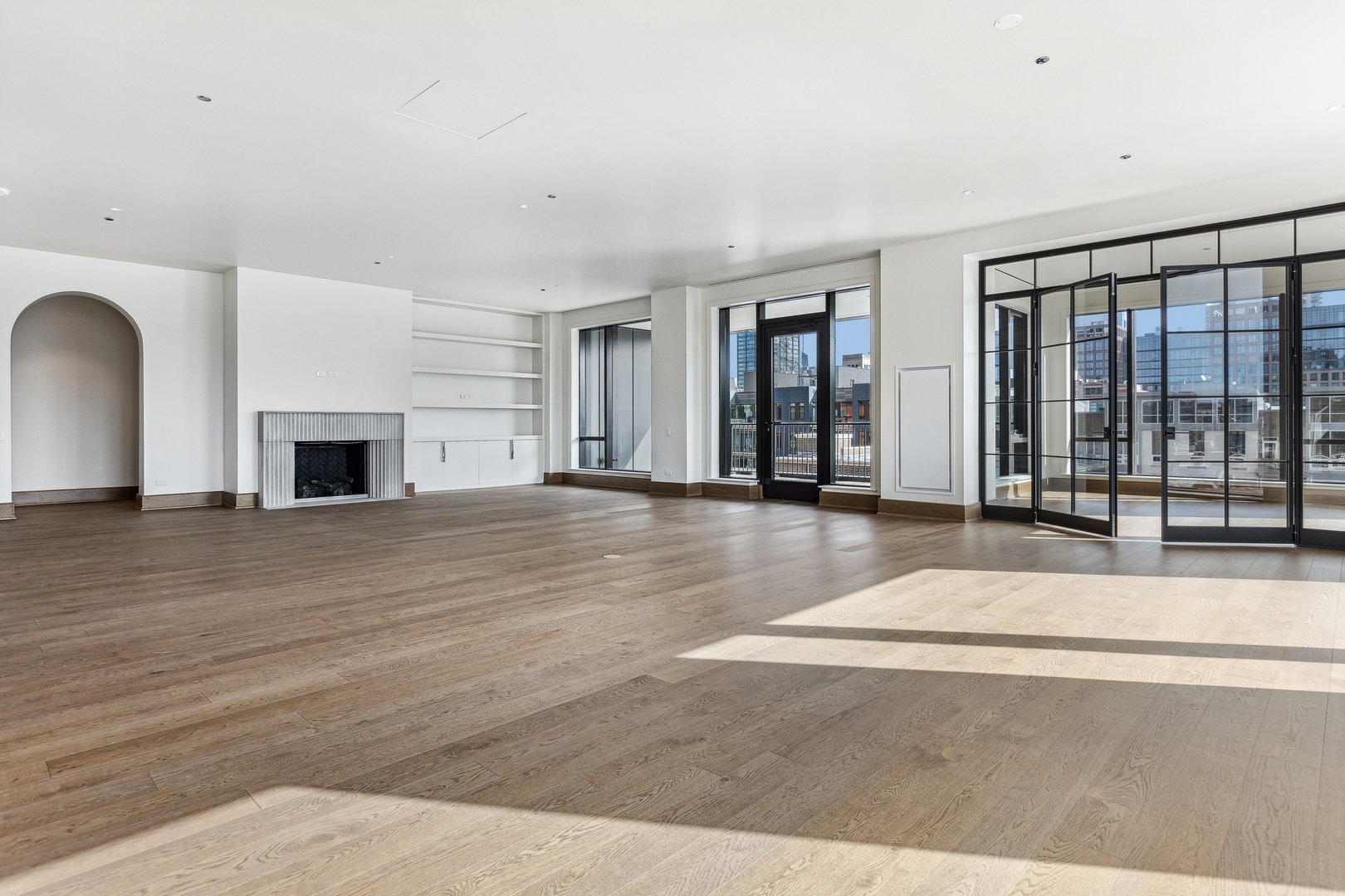 21 North May Street, Unit 601 Chicago, IL 60607 - Photo 15 of 64 a view of a livingroom with wooden floor and fireplace