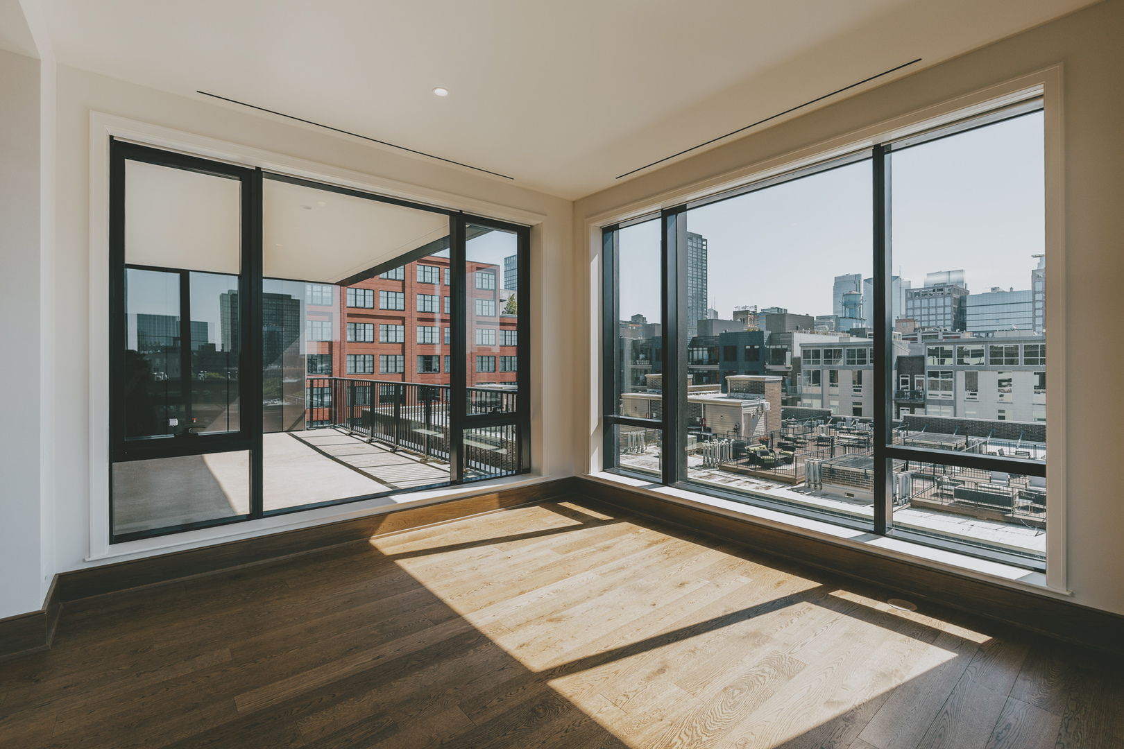 21 North May Street, Unit 601 Chicago, IL 60607 - Photo 18 of 64 a view of a room with wooden floor and windows