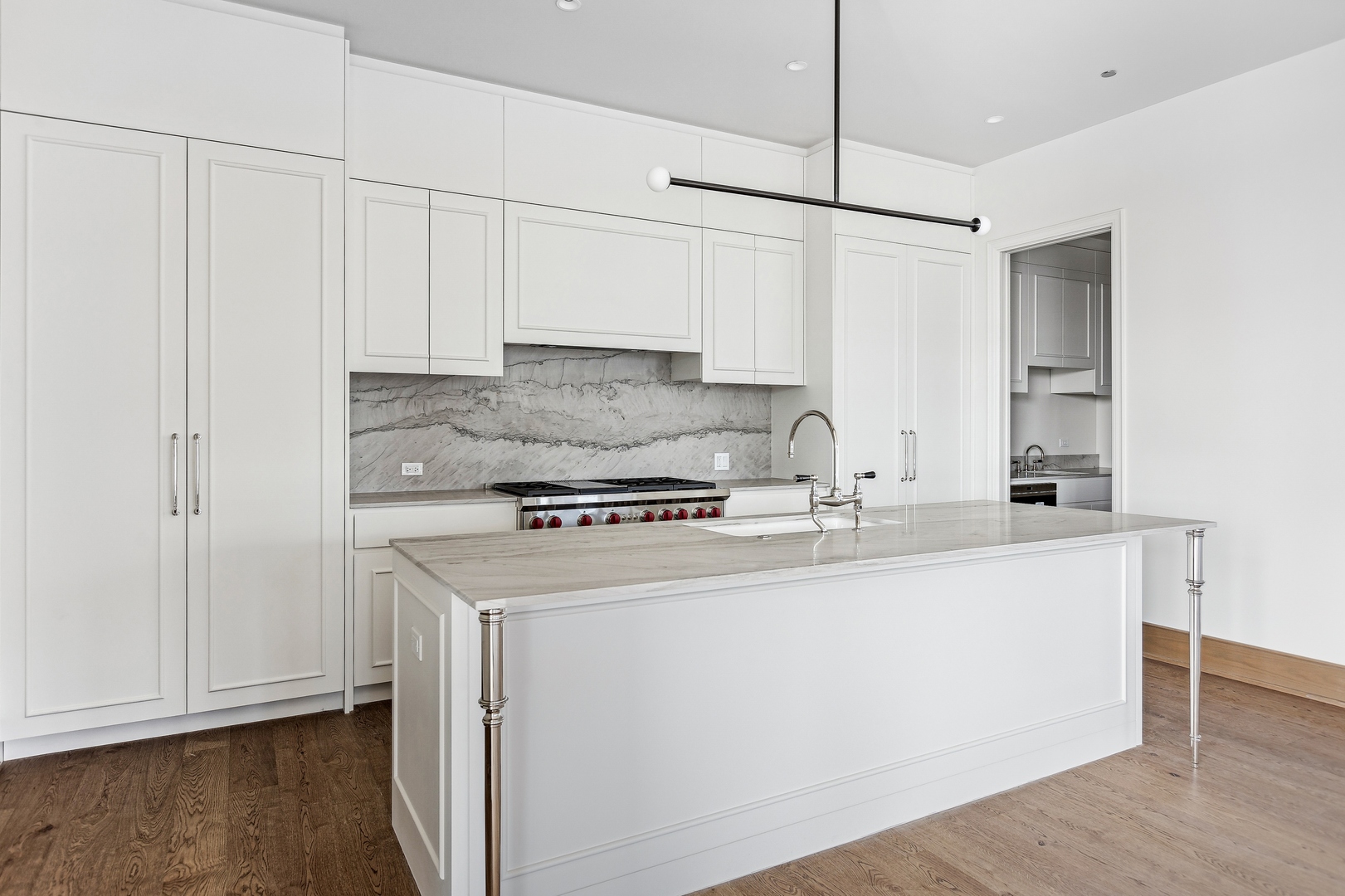 21 North May Street, Unit 601 Chicago, IL 60607 - Photo 28 of 64 a kitchen with stainless steel appliances granite countertop a sink a stove a refrigerator a white cabinets and wooden floor