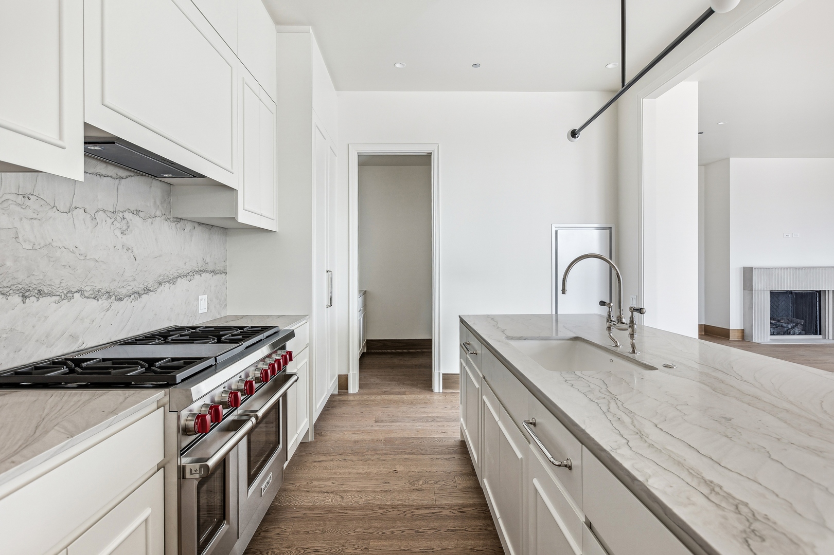 21 North May Street, Unit 601 Chicago, IL 60607 - Photo 29 of 64 a kitchen with granite countertop a sink stove and cabinets