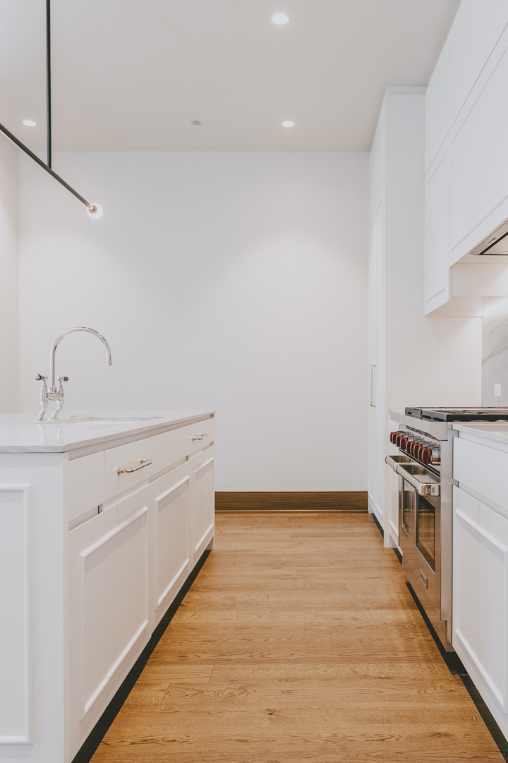 21 North May Street, Unit 601 Chicago, IL 60607 - Photo 30 of 64 a view of a kitchen with wooden floor and electronic appliances