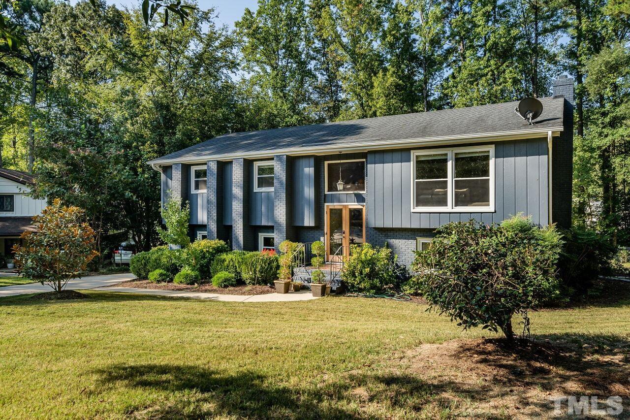 1500 Windbur Place Raleigh, NC 27609 - Photo 1 of 30 a front view of a house with garden