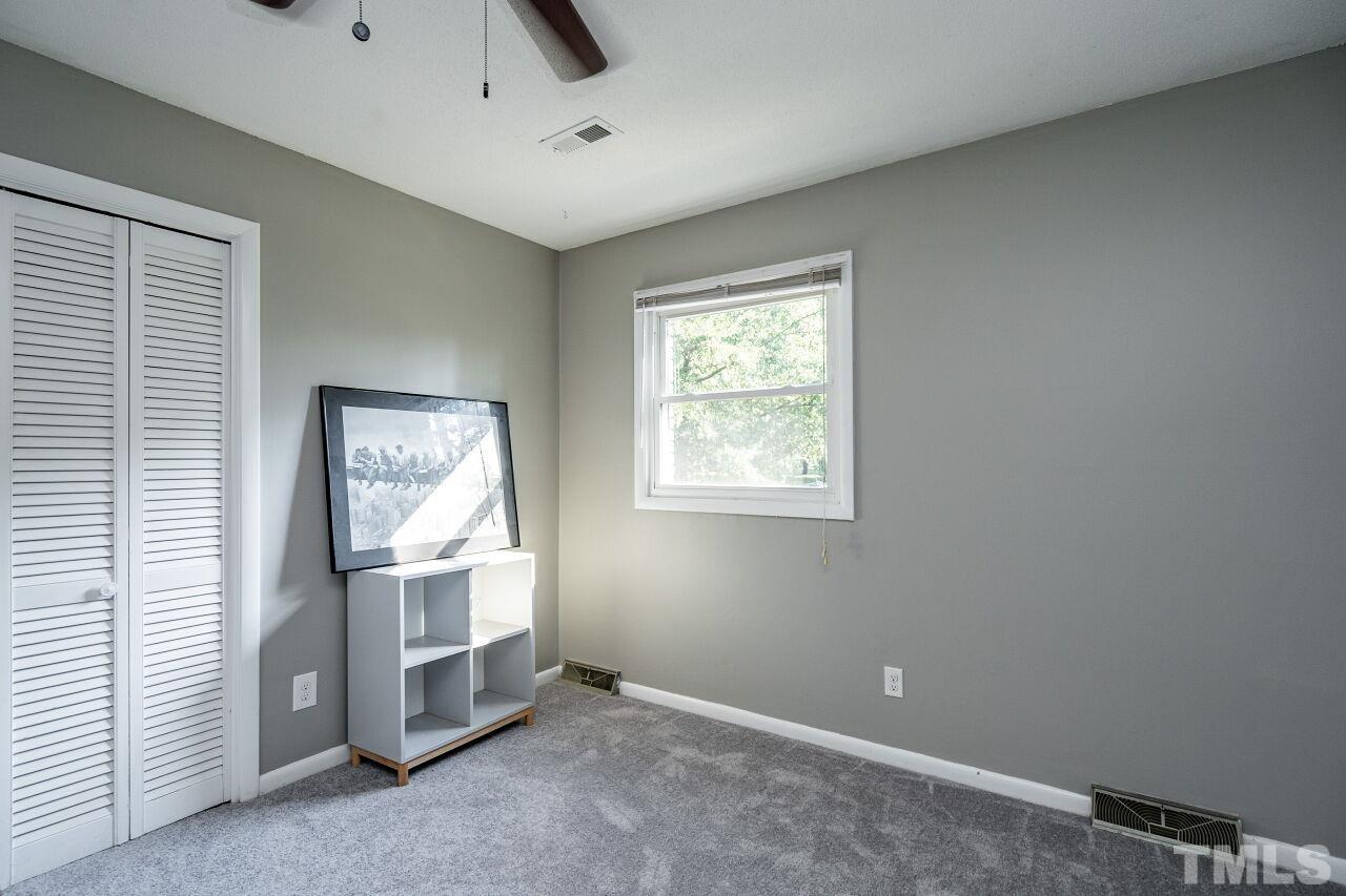 1500 Windbur Place Raleigh, NC 27609 - Photo 16 of 30 an empty room with windows