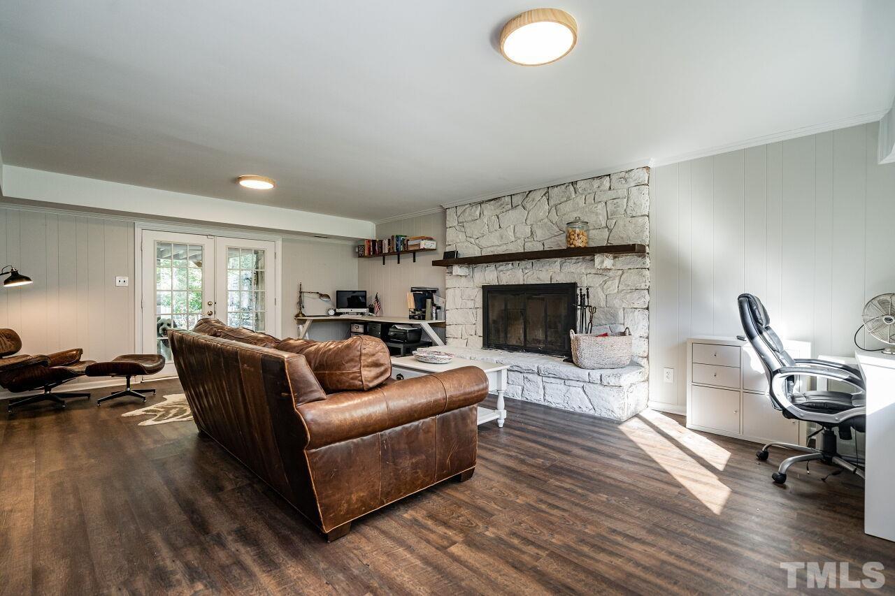 1500 Windbur Place Raleigh, NC 27609 - Photo 20 of 30 a living room with furniture and a fireplace