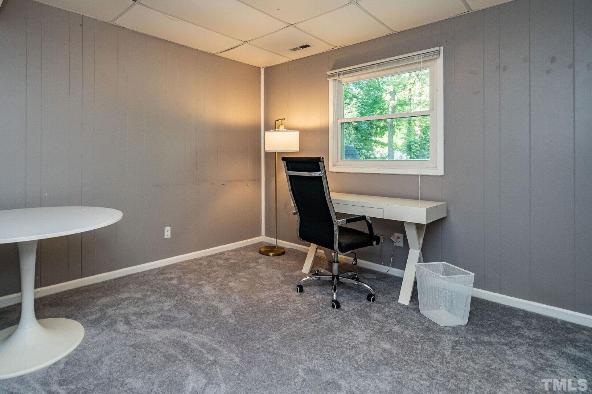 1500 Windbur Place Raleigh, NC 27609 - Photo 23 of 30 a view of a workspace with furniture and a window