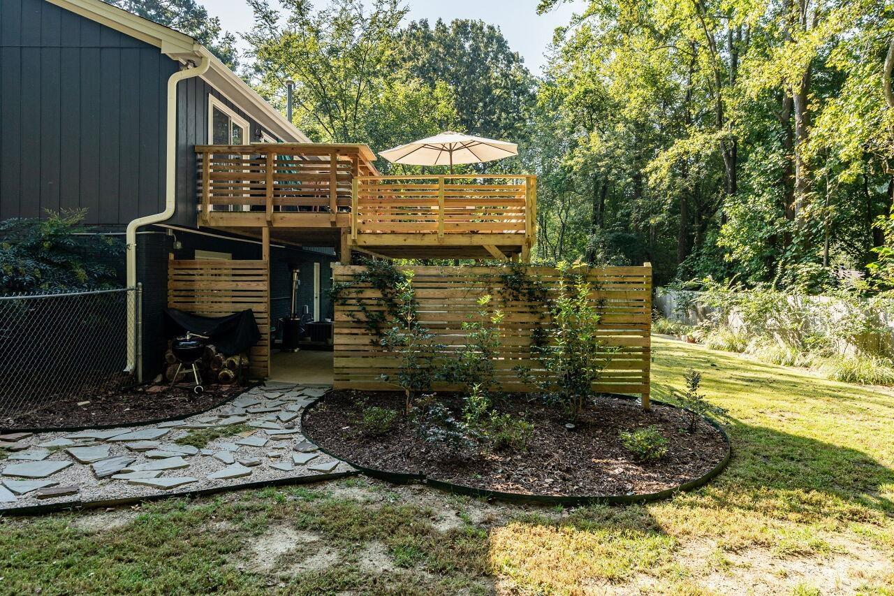 1500 Windbur Place Raleigh, NC 27609 - Photo 28 of 30 a front view of a house with a yard