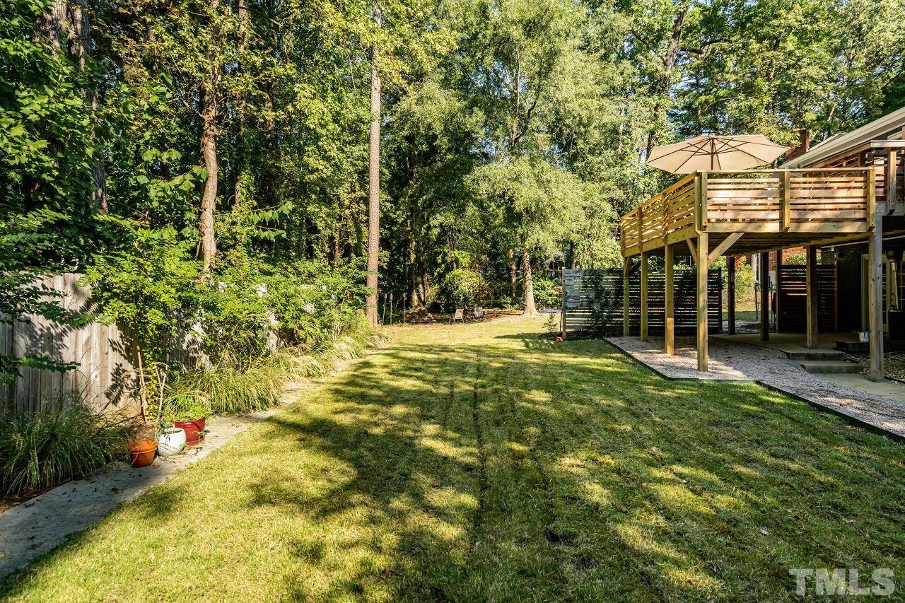 1500 Windbur Place Raleigh, NC 27609 - Photo 29 of 30 a view of a yard with plants and large trees