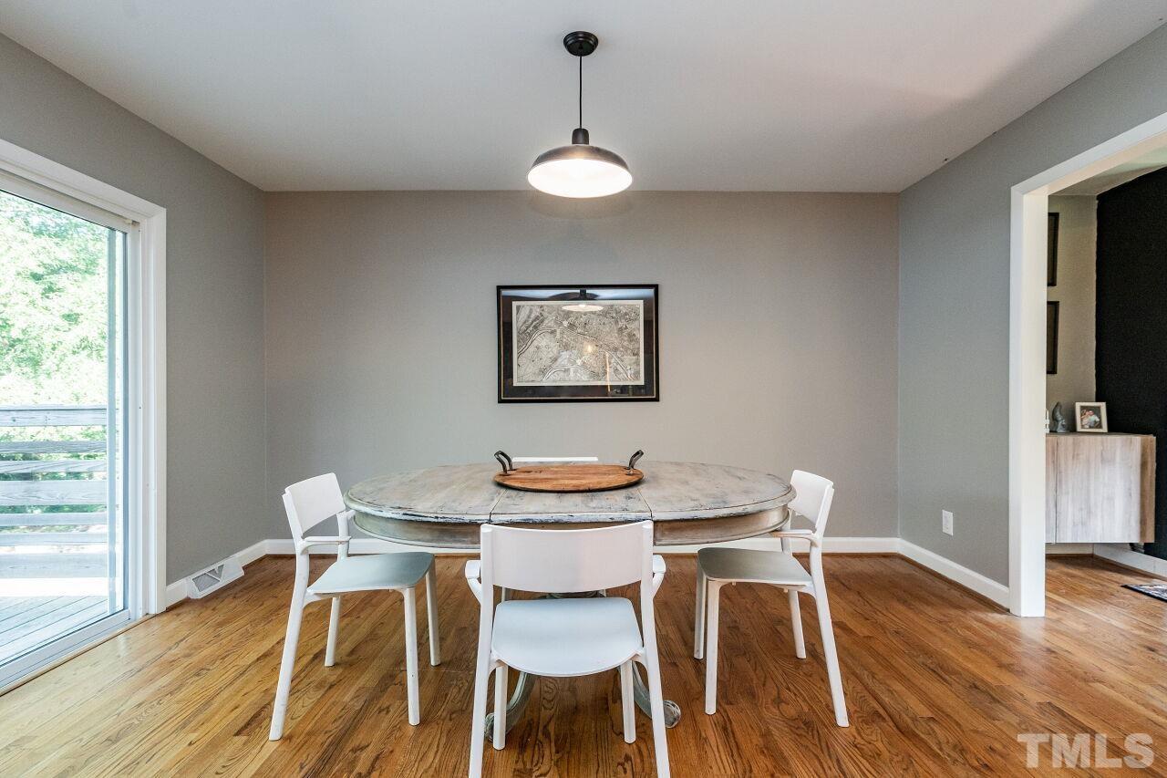 1500 Windbur Place Raleigh, NC 27609 - Photo 10 of 30 a dining room with furniture and wooden floor