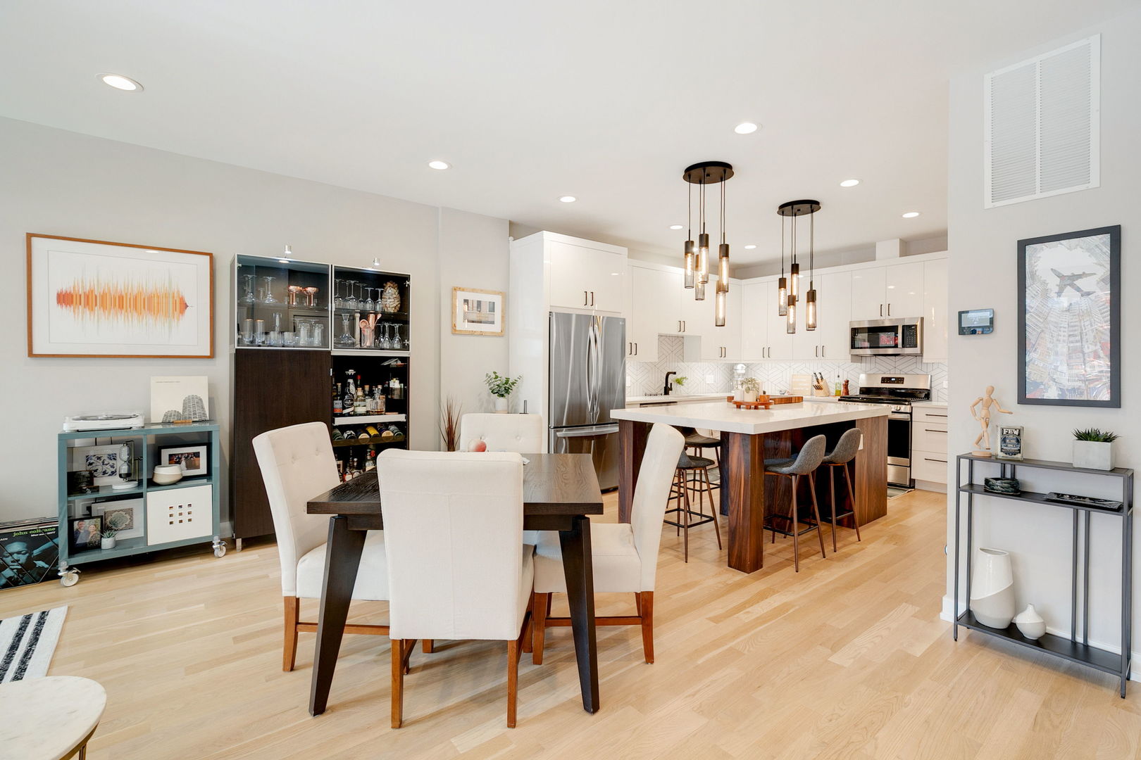 2404 West Moffat Street, Unit 1 Chicago, IL 60647 - Photo 17 of 41 a view of kitchen with kitchen island dining table and chairs