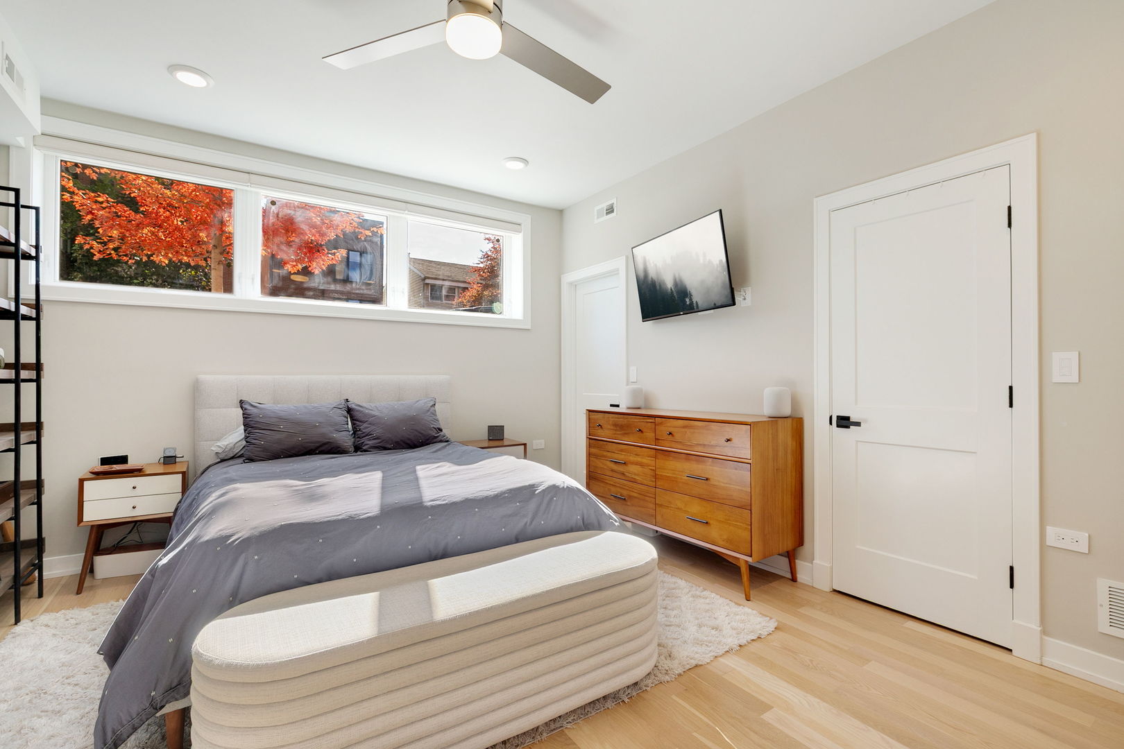 2404 West Moffat Street, Unit 1 Chicago, IL 60647 - Photo 23 of 41 a bedroom with a bed and painting on the wall