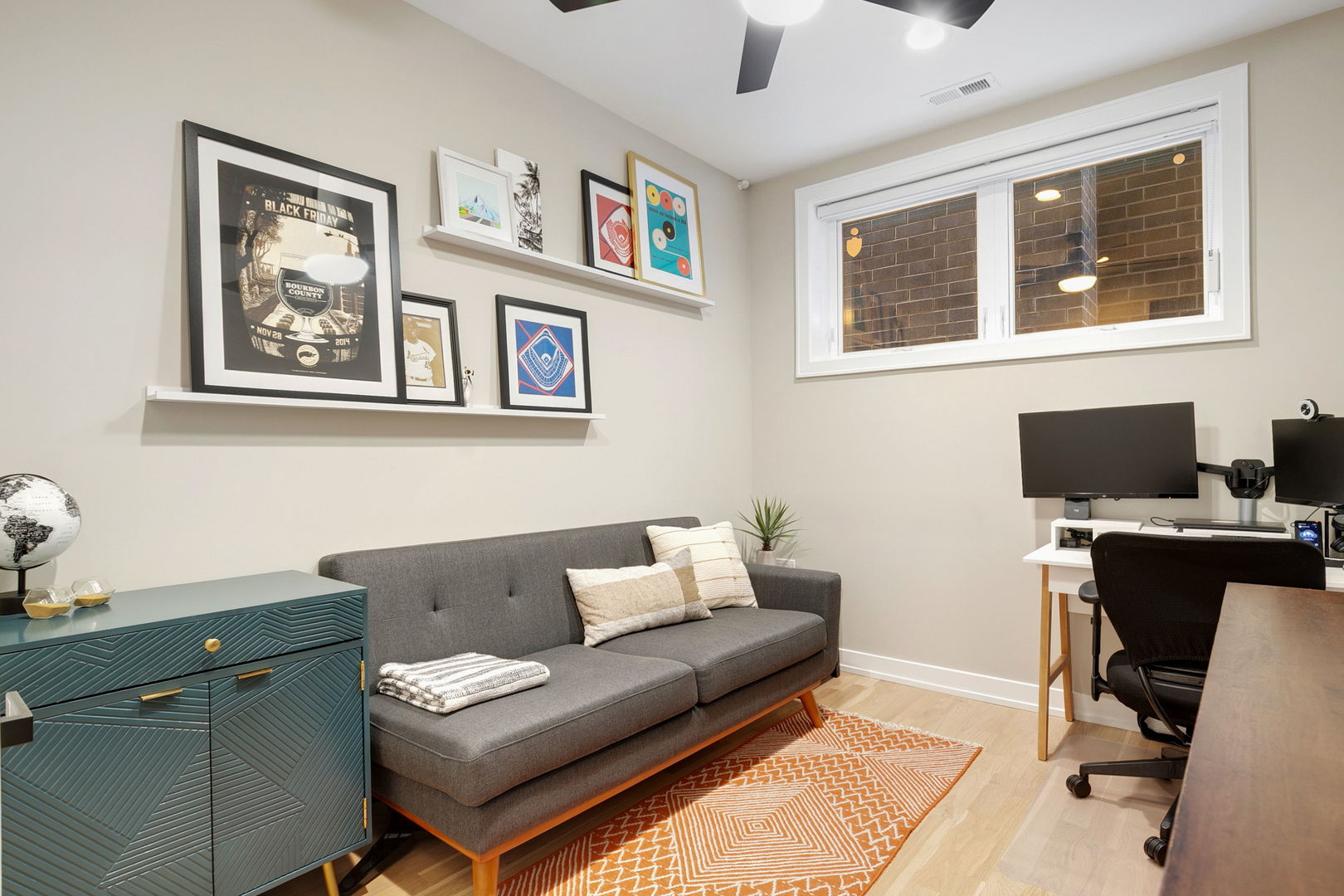 2404 West Moffat Street, Unit 1 Chicago, IL 60647 - Photo 28 of 41 a living room with furniture a desk and chair with a bookshelf