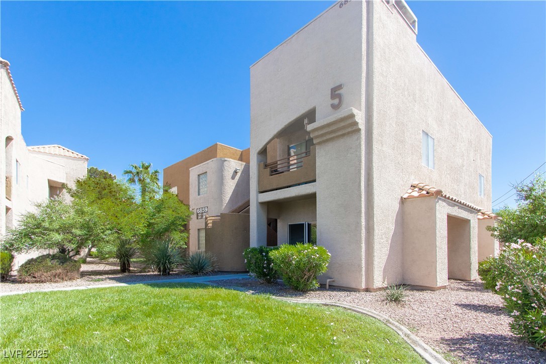 6859 Tamarus Street, Unit 101 Las Vegas, NV 89119 - Photo 1 of 21