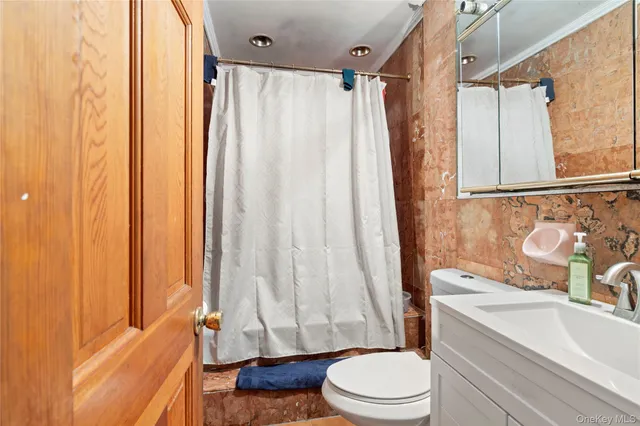 a bathroom with a toilet a sink and a bathtub