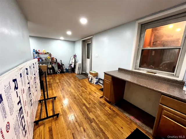 a view of a living room with furniture and a flat screen tv