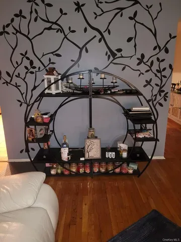 a picture of a room with chandeliers and wooden floor