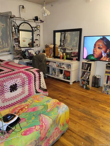 a bedroom with bed and window