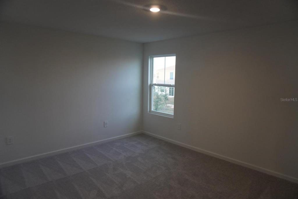 3779 Bergamot Boulevard Lake Alfred, FL 33850 - Photo 12 of 25 an empty room with windows