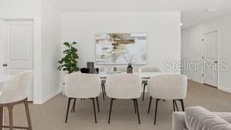 3779 Bergamot Boulevard Lake Alfred, FL 33850 - Photo 17 of 25 a view of a dining room with furniture and wooden floor