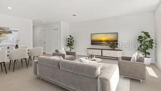 3779 Bergamot Boulevard Lake Alfred, FL 33850 - Photo 20 of 25 a living room with furniture and a flat screen tv