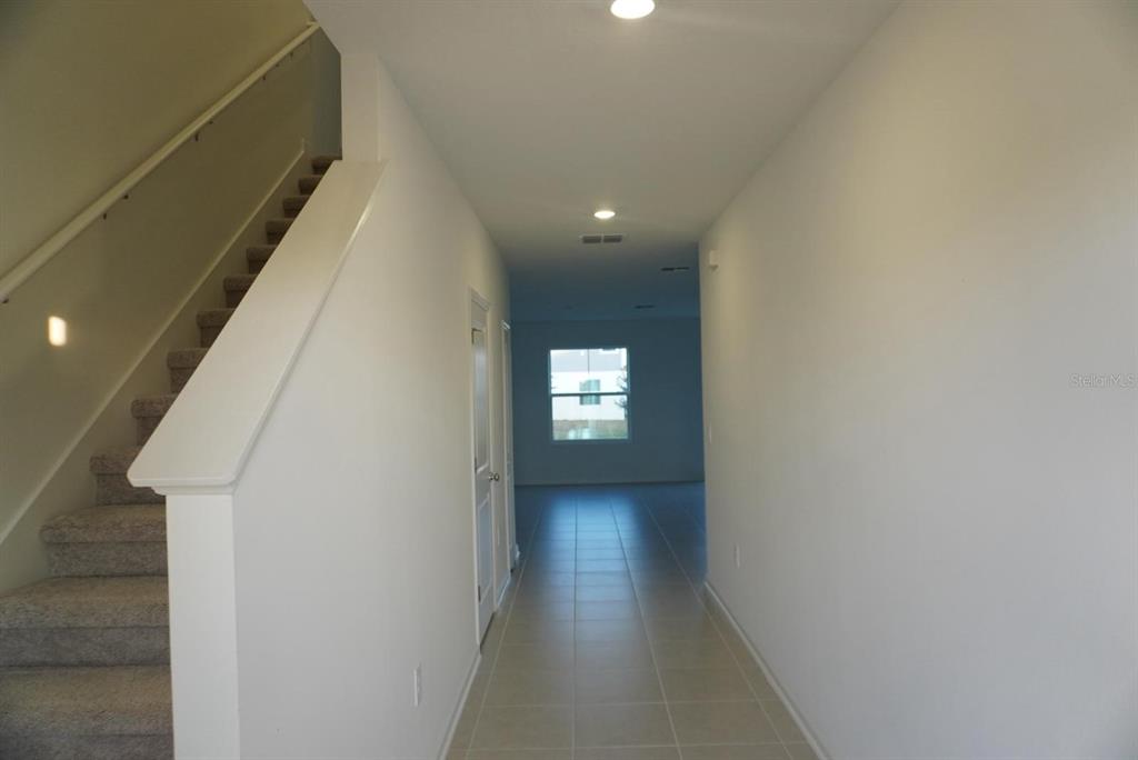 3779 Bergamot Boulevard Lake Alfred, FL 33850 - Photo 2 of 25 a view of hallway with stairs