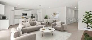 3779 Bergamot Boulevard Lake Alfred, FL 33850 - Photo 21 of 25 a living room with furniture and a large window