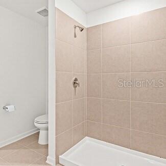 3779 Bergamot Boulevard Lake Alfred, FL 33850 - Photo 24 of 25 a bathroom with a shower and a toilet