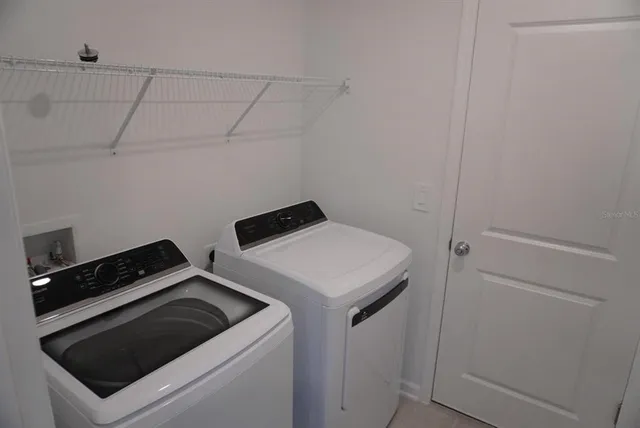 a utility room with dryer and washer