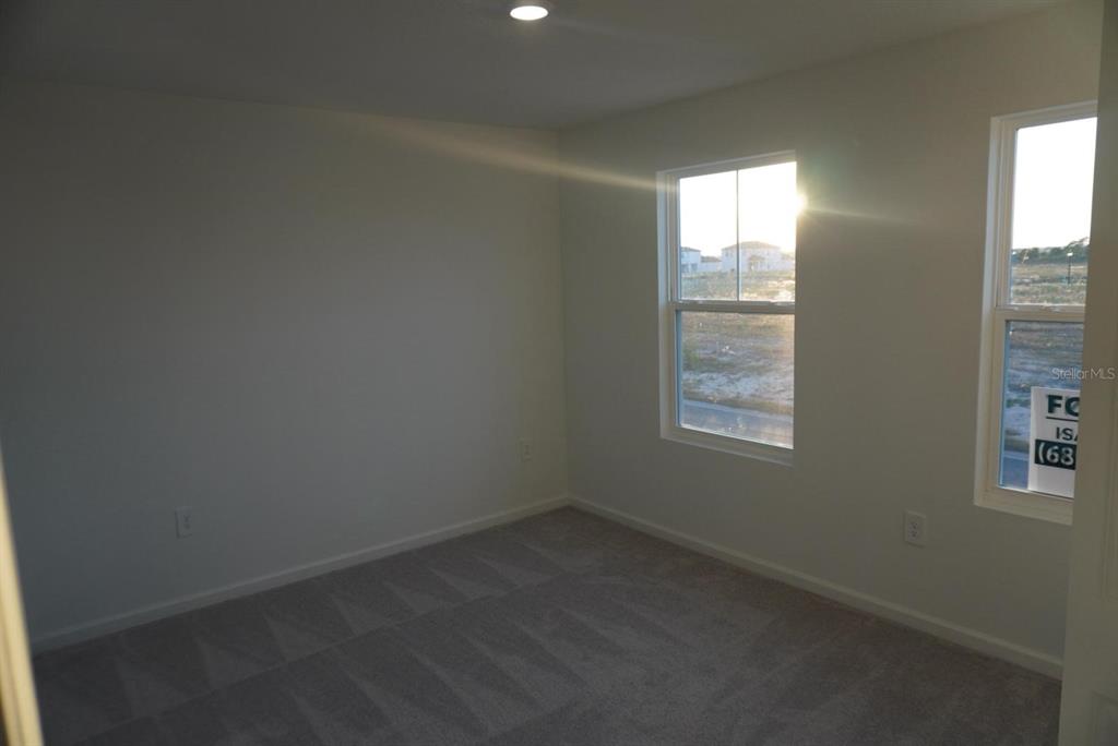 3779 Bergamot Boulevard Lake Alfred, FL 33850 - Photo 5 of 25 an empty room with windows