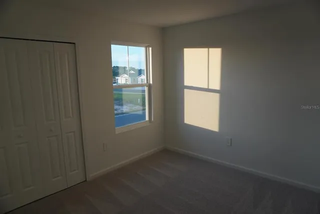 an empty room with windows