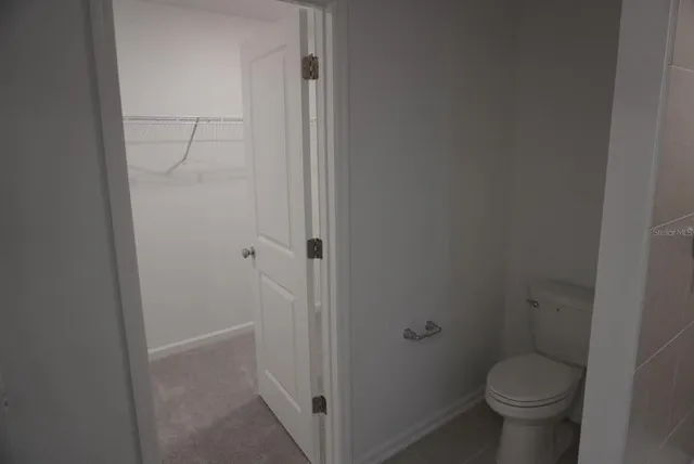 a bathroom with a toilet and a sink