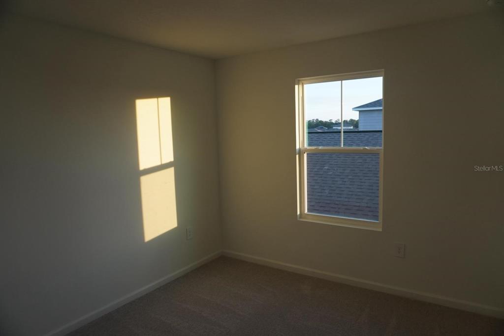 3779 Bergamot Boulevard Lake Alfred, FL 33850 - Photo 9 of 25 a view of an empty room with a window
