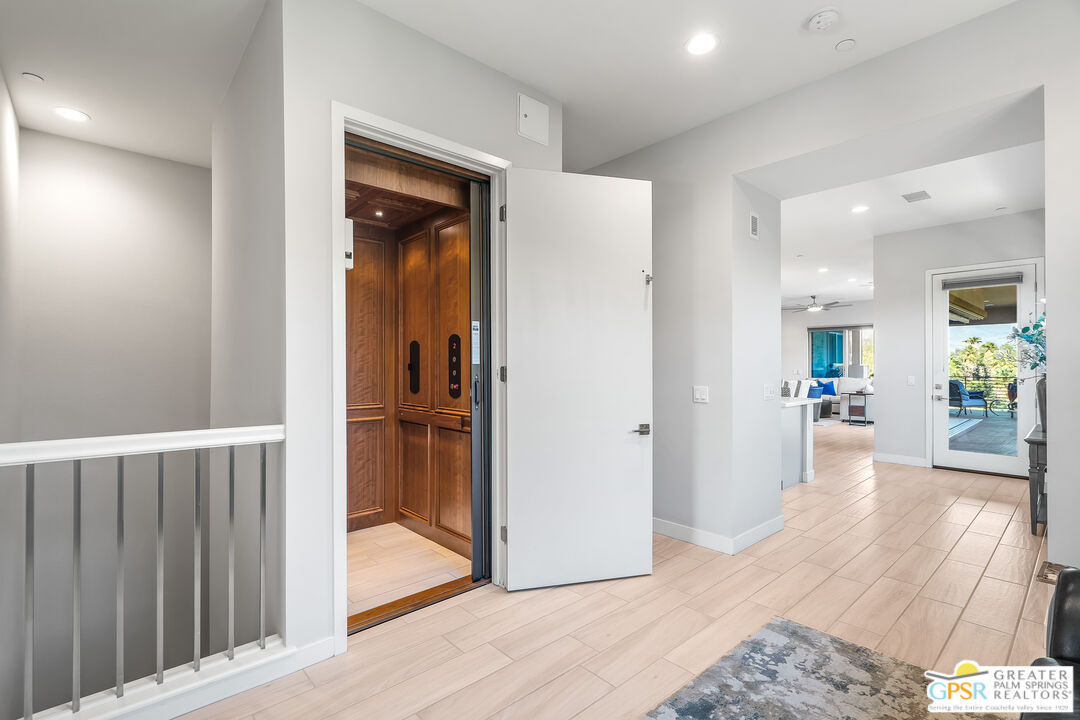 204 Retreat Circle Palm Desert, CA 92260 - Photo 12 of 60 a view of a hallway view with wooden floor and a living room
