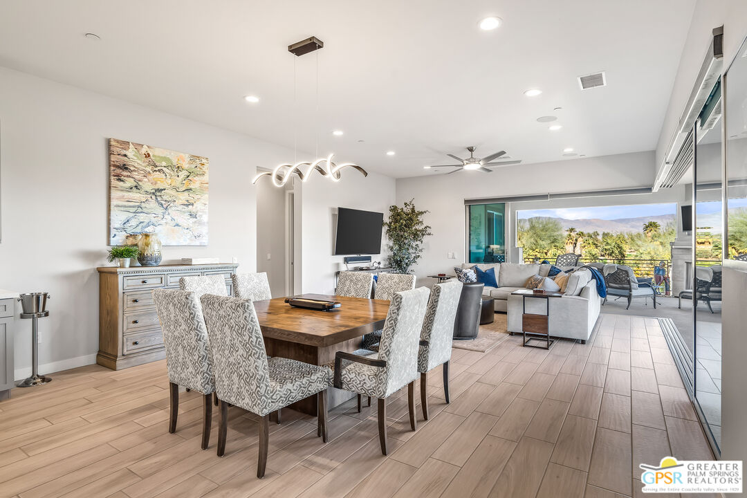204 Retreat Circle Palm Desert, CA 92260 - Photo 15 of 60 a dining room with furniture and wooden floor