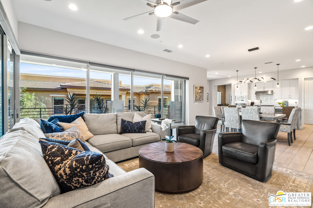 204 Retreat Circle Palm Desert, CA 92260 - Photo 18 of 60 a living room with furniture and a large window