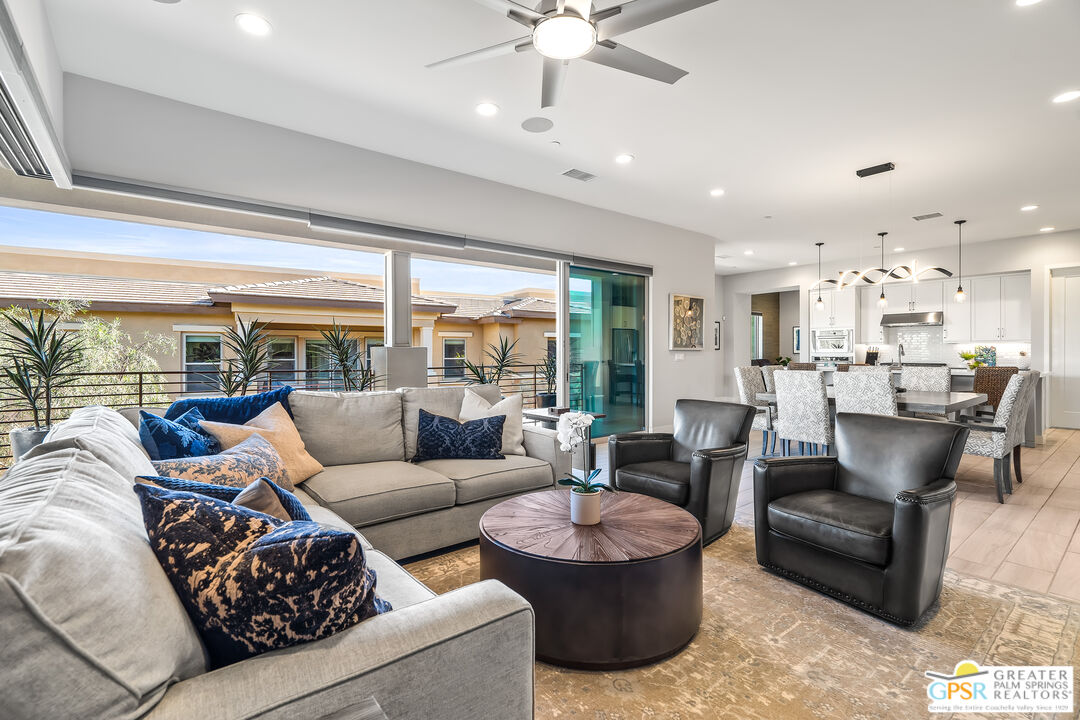 204 Retreat Circle Palm Desert, CA 92260 - Photo 19 of 60 a living room with furniture and a large window