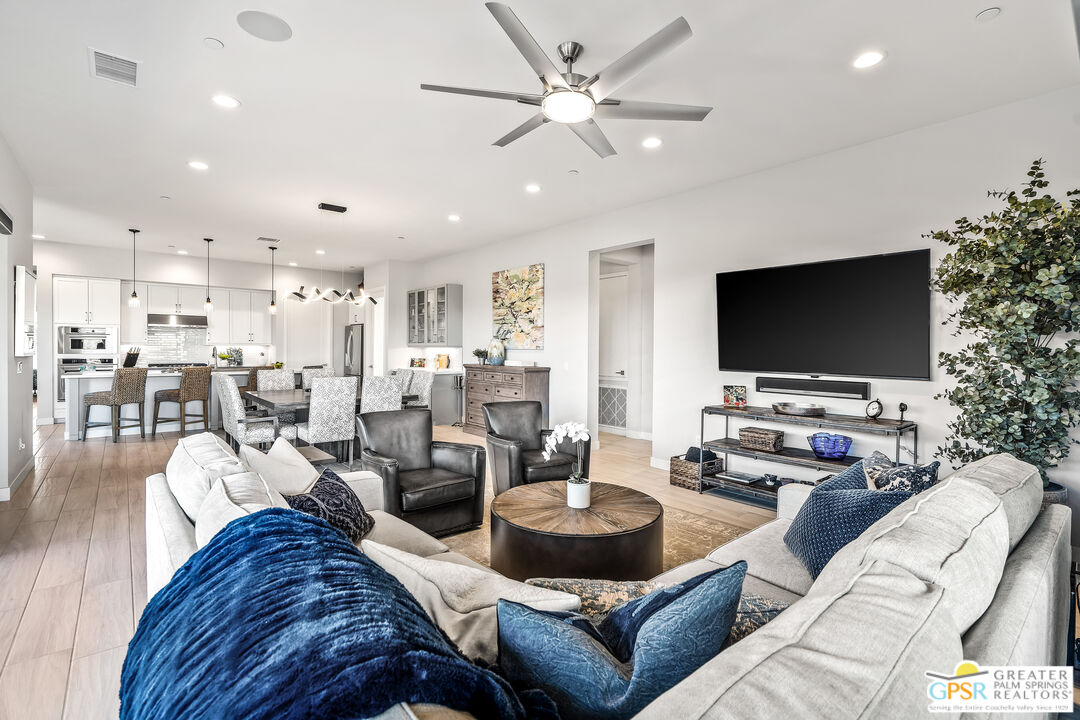 204 Retreat Circle Palm Desert, CA 92260 - Photo 20 of 60 a living room with furniture and a flat screen tv