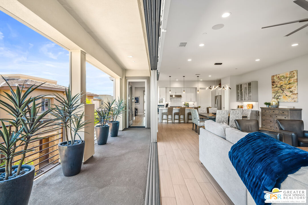 204 Retreat Circle Palm Desert, CA 92260 - Photo 21 of 60 a living room with furniture and a table