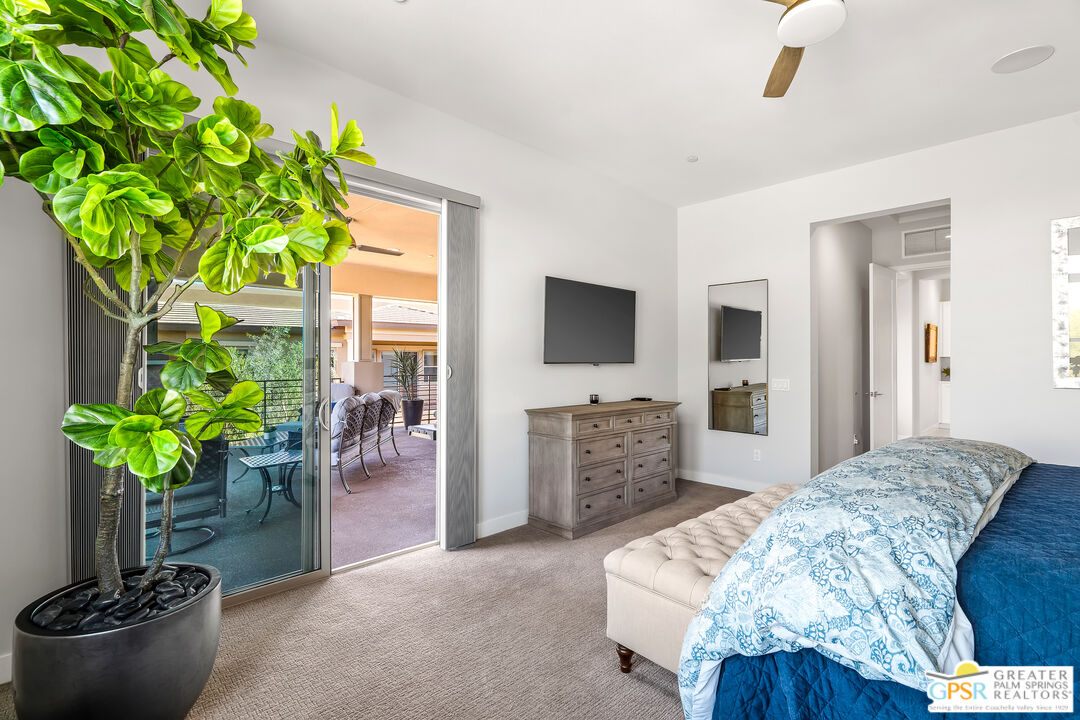 204 Retreat Circle Palm Desert, CA 92260 - Photo 37 of 60 a living room with furniture and a potted plant