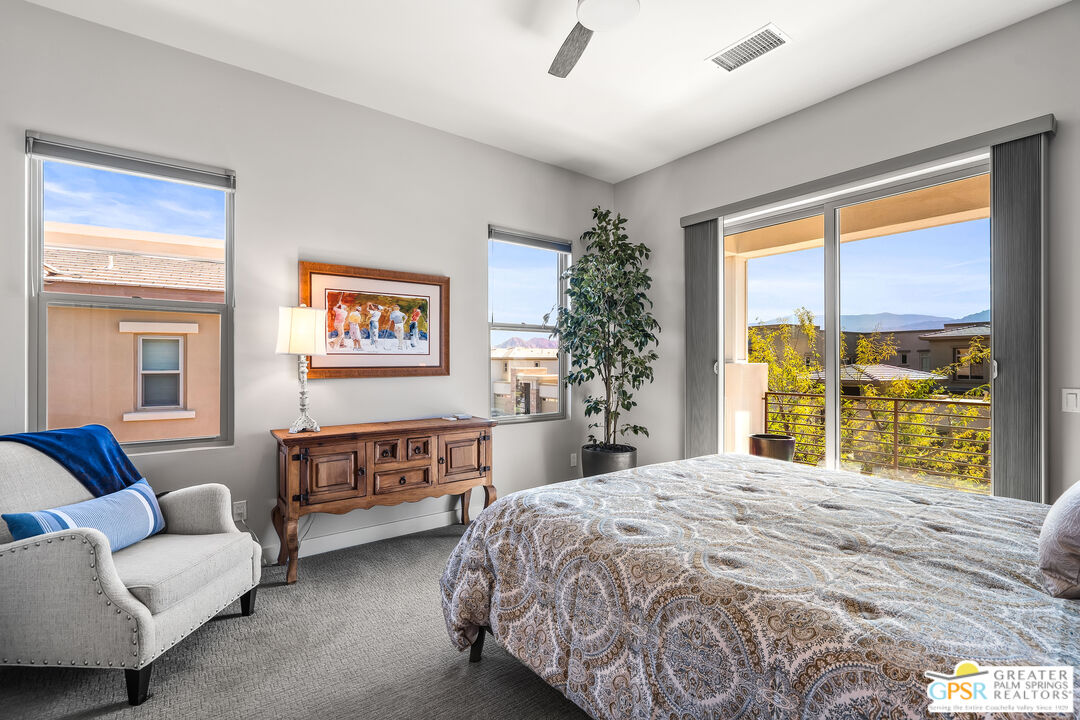 204 Retreat Circle Palm Desert, CA 92260 - Photo 43 of 60 a bedroom with a bed and a couch