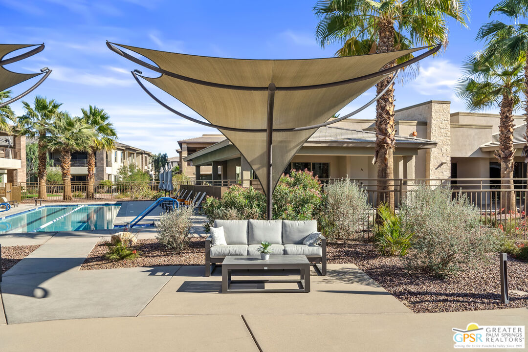 204 Retreat Circle Palm Desert, CA 92260 - Photo 58 of 60 a building outdoor space with patio furniture and potted plants