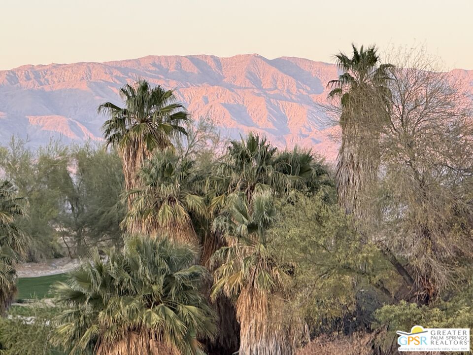 204 Retreat Circle Palm Desert, CA 92260 - Photo 6 of 60 a view of a houses with a yard