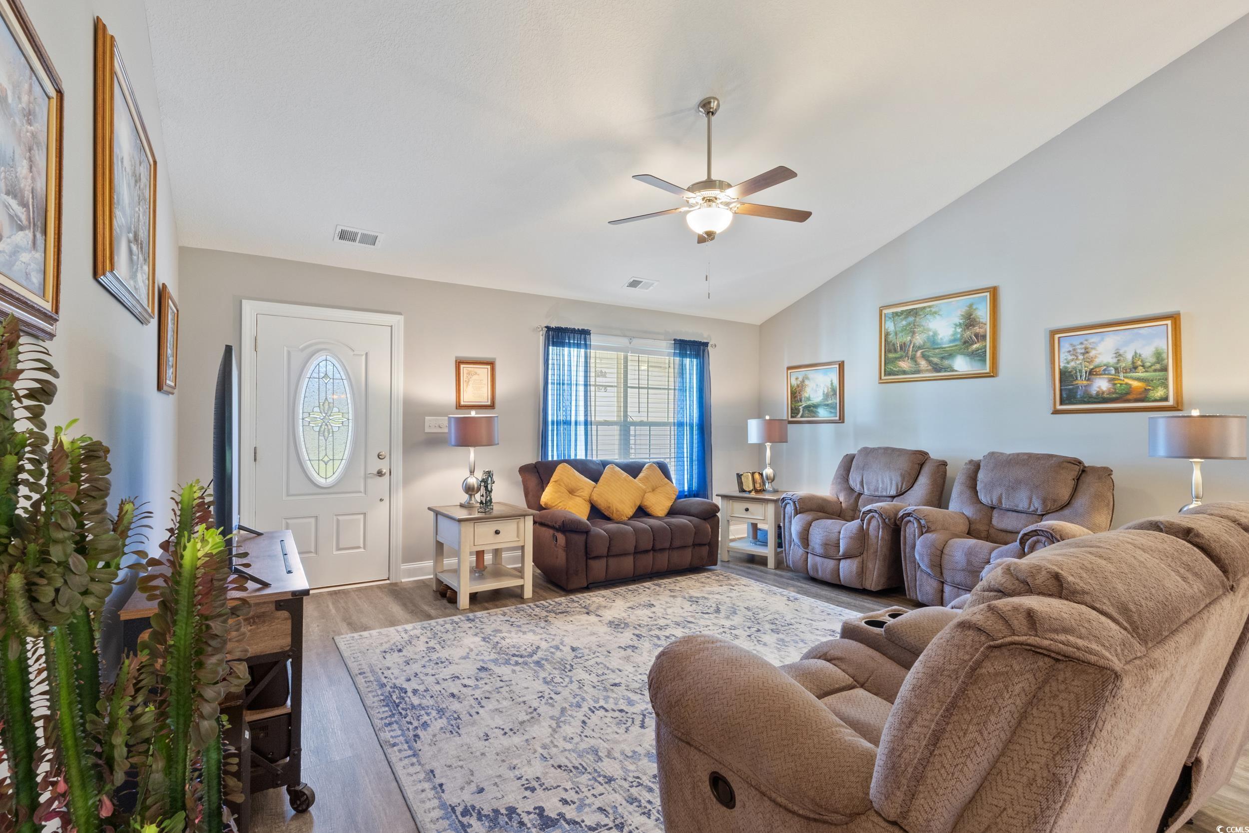 1353 Hucks Road Aynor, SC 29511 - Photo 12 of 40 Living room featuring lofted ceiling, wood finished floors, and ceiling fan
