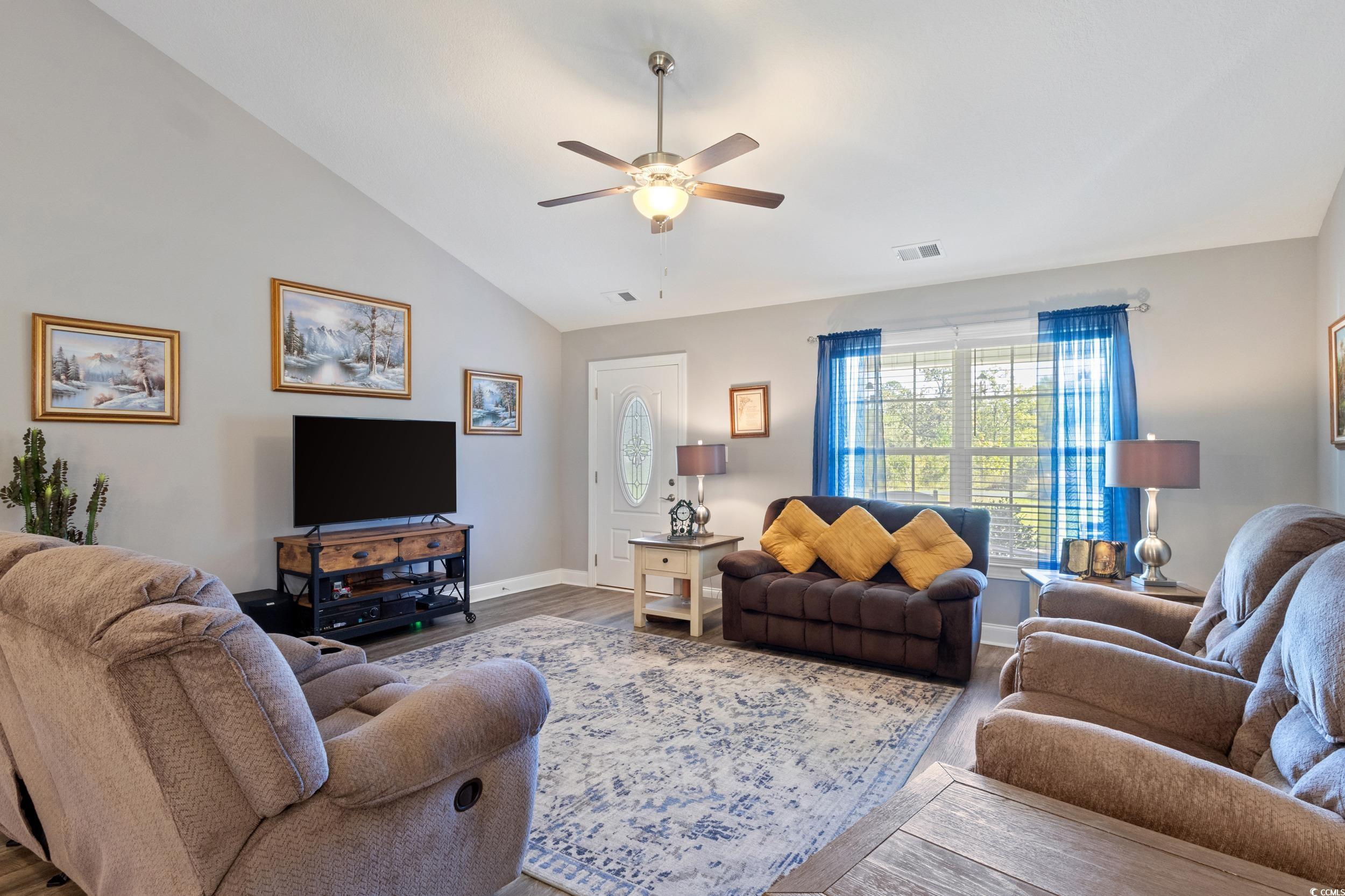 1353 Hucks Road Aynor, SC 29511 - Photo 13 of 40 Living area with a ceiling fan, wood finished floors, and high vaulted ceiling