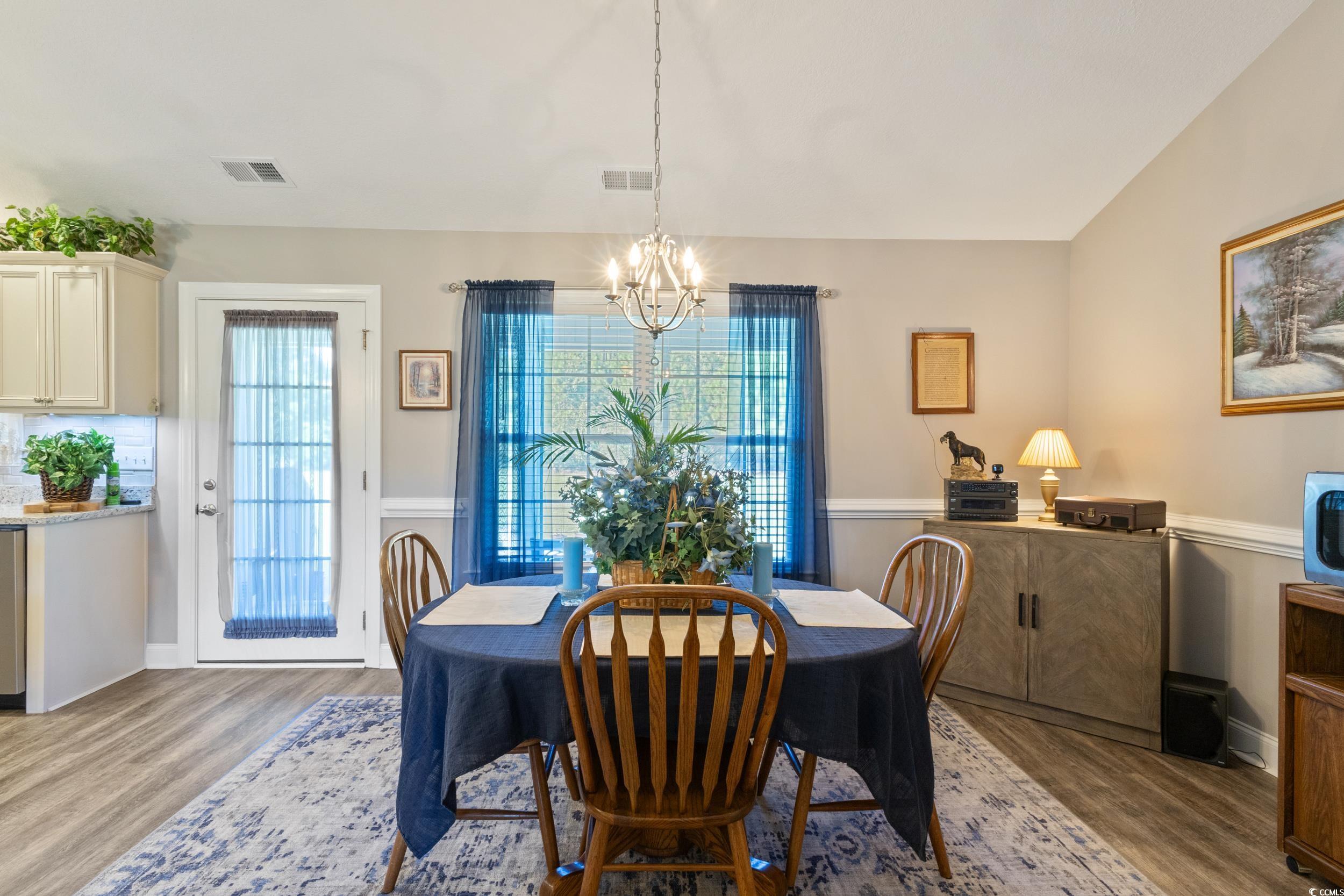 1353 Hucks Road Aynor, SC 29511 - Photo 14 of 40 Dining room featuring light wood-style flooring and a chandelier